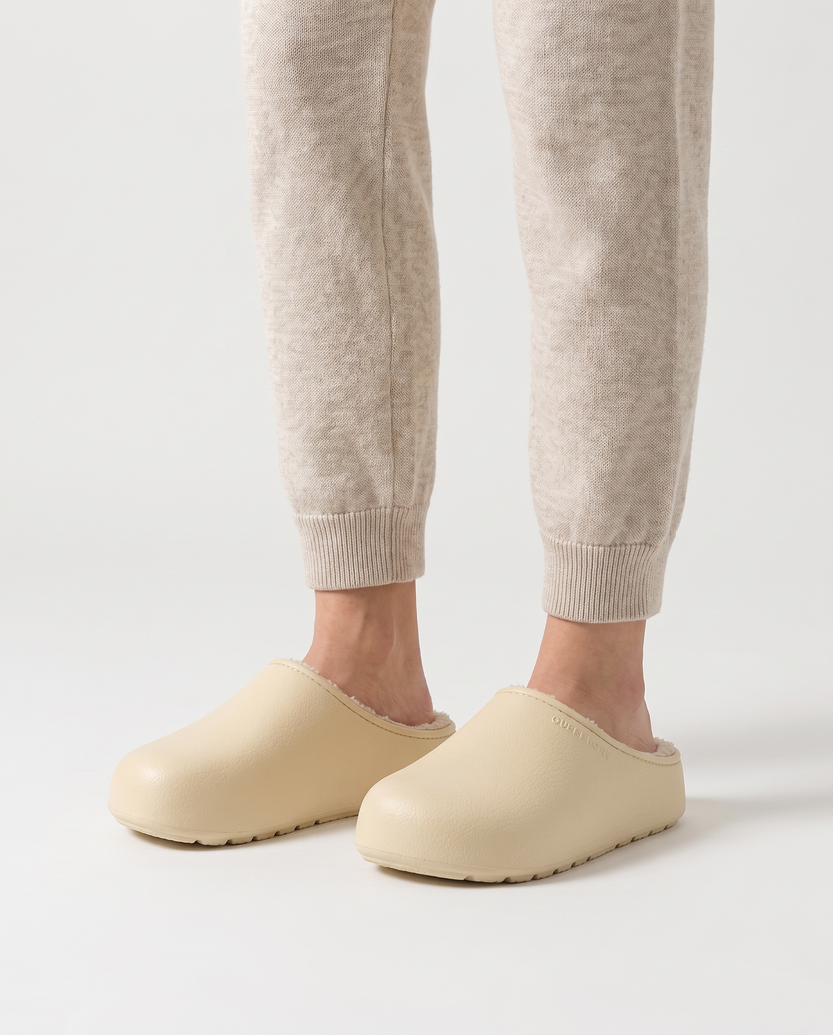 Women's Plush-Lined Winter Clog Slippers in Cream – three-quarter standing view