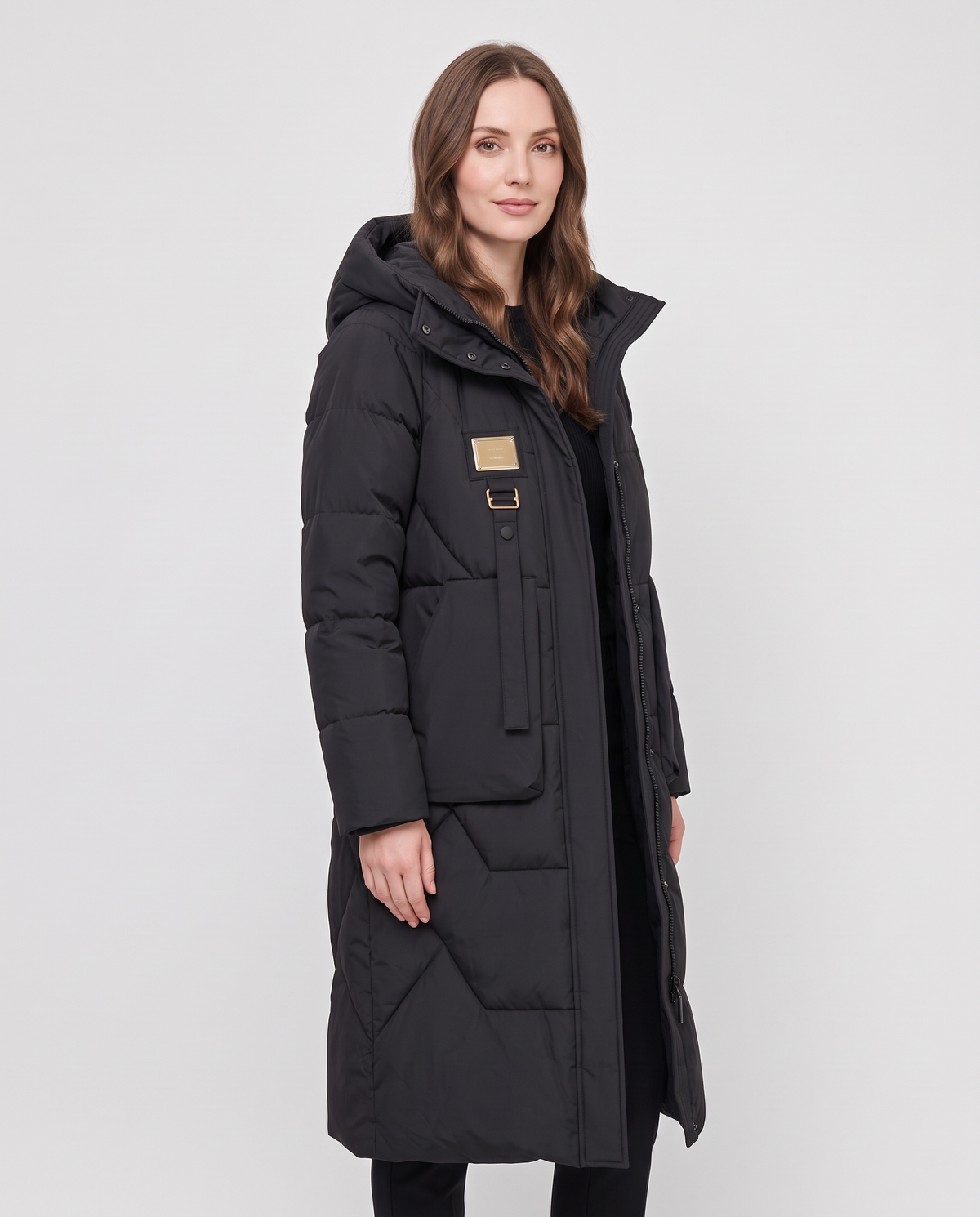 Women's black long hooded waterproof puffer jacket, side view