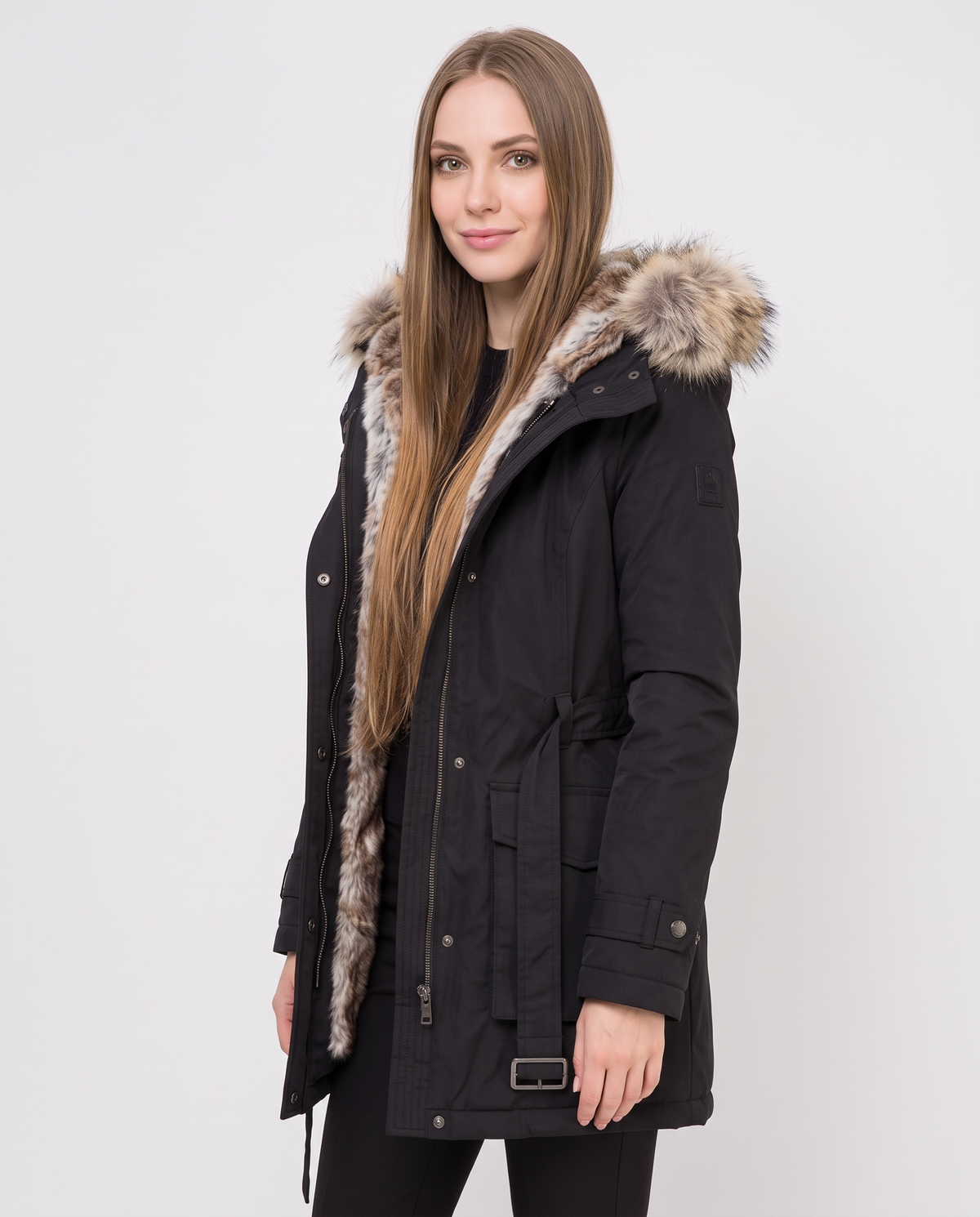 Women's black hooded parka coat with faux fur trim, side view