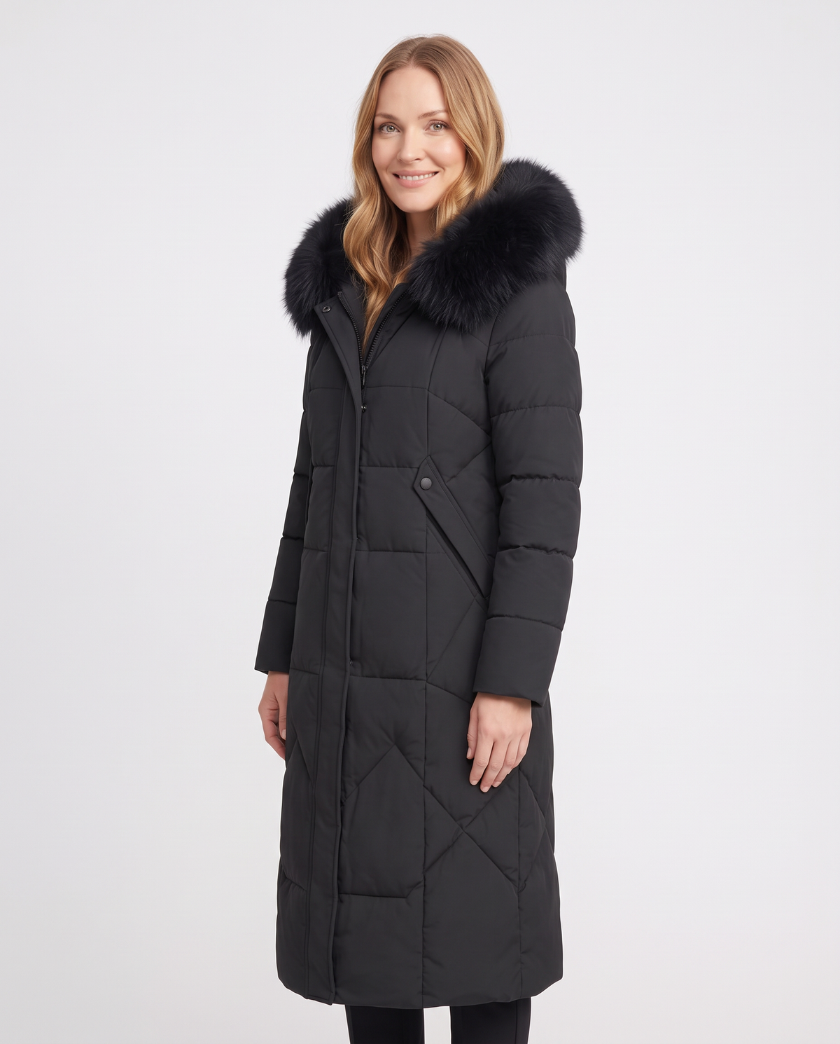 Women's black long quilted puffer coat with faux fur collar, side view