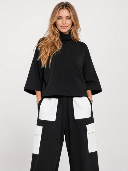 Women's black oversized sweatshirt and cargo jogger tracksuit, front view