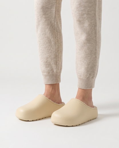 Women's Plush-Lined Winter Clog Slippers in Cream – three-quarter standing view