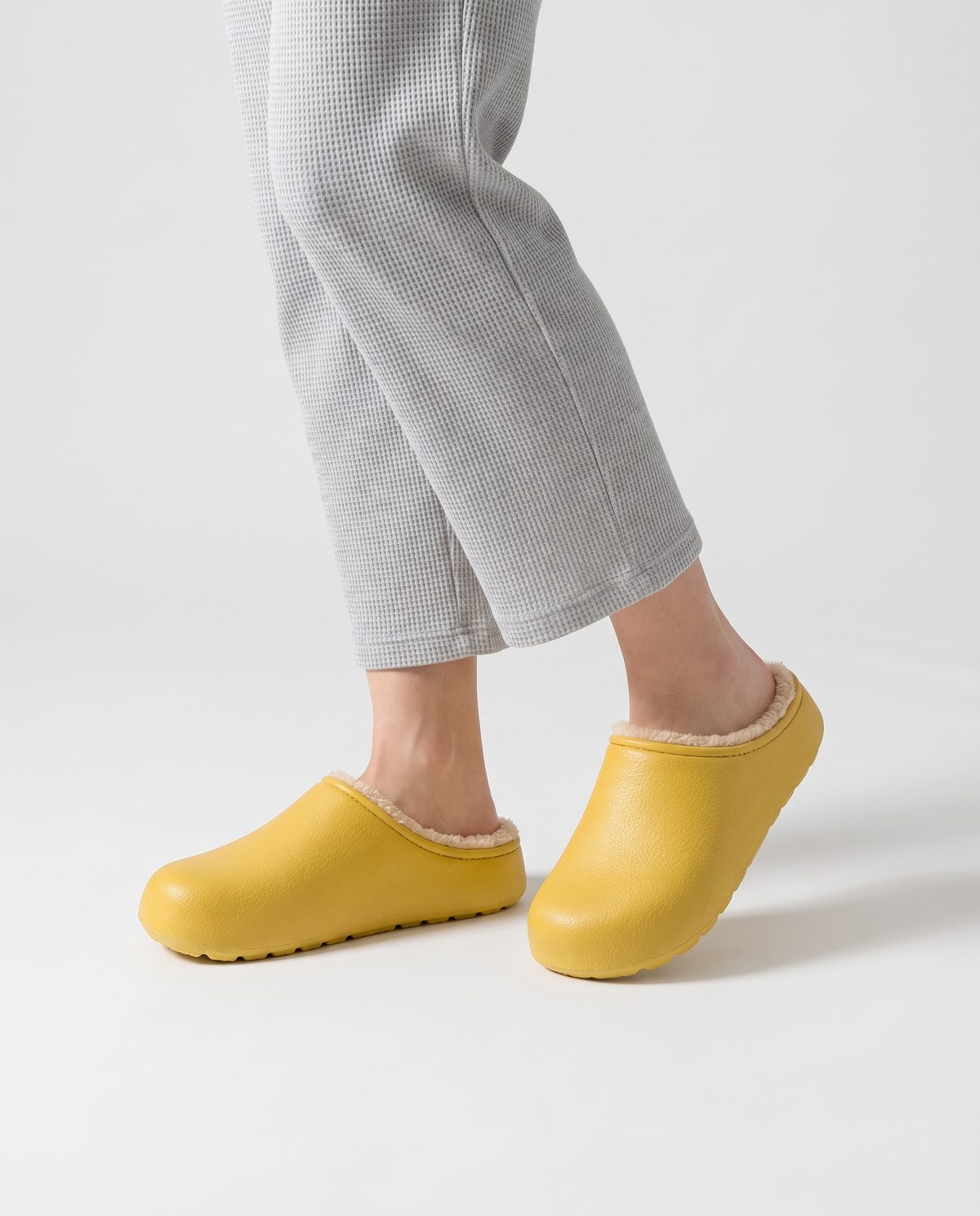 Women's Plush-Lined Winter Clog Slippers in Yellow – three-quarter standing view