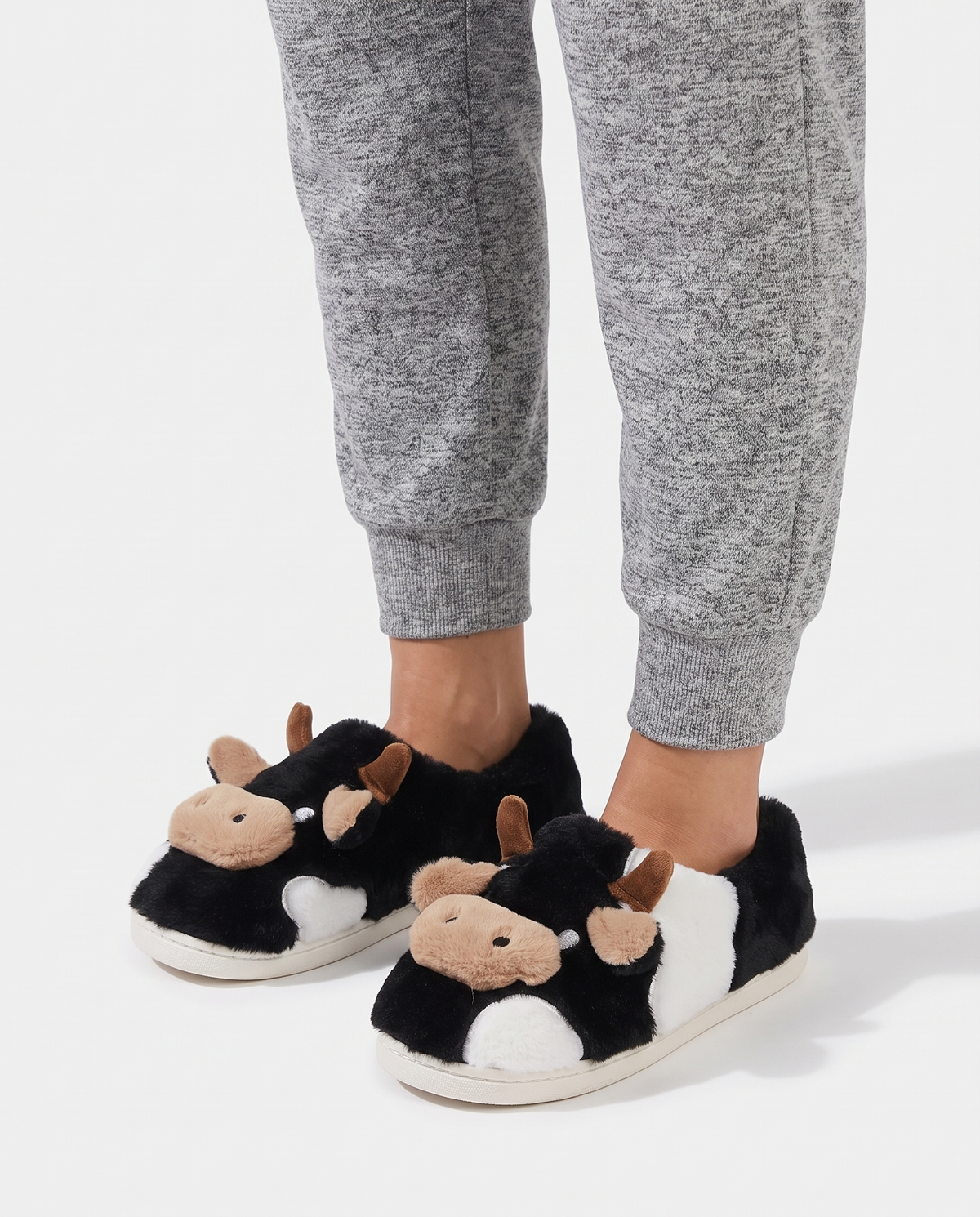 Women's Printed Plush House Slippers in Black – three-quarter standing view
